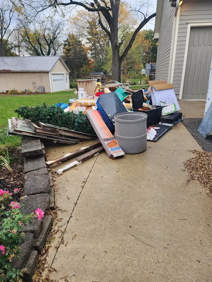 Dumpster being loaded with debris for Commercial Dumpster Rental in La Grange
